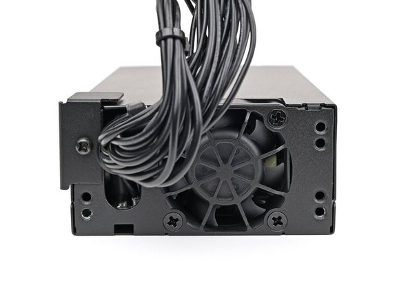 Use your Framework Desktop Screwdriver to Install the 5.8 mm‑long Phillips screw securing the mounting bracket.