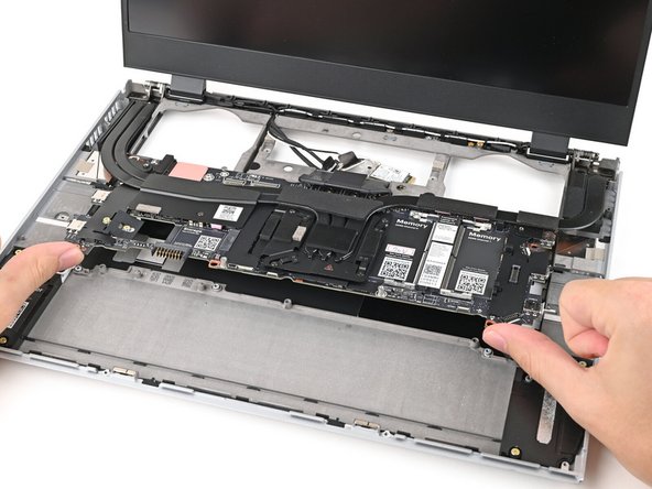 Lift the Mainboard off its alignment pegs and remove it.