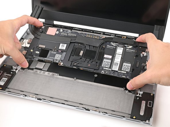Lift the Mainboard off its alignment pegs and remove it.