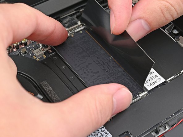 Insert the contact edge into the socket at a shallow angle. The gold contacts should mostly be covered by the socket.