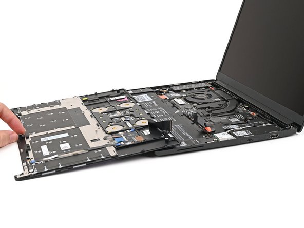Rest the Input Cover over the Battery, making sure the Touchpad Cable isn't being strained.