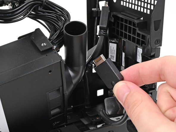 Thread the right Expansion card cable through the gap between the power supply and its duct.