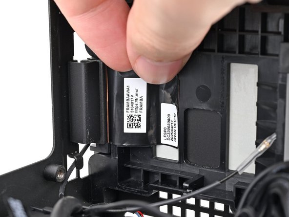 Press the right antenna's copper film onto the chassis and adhere it.