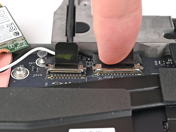 Press the two display connectors straight down into their sockets to connect them.