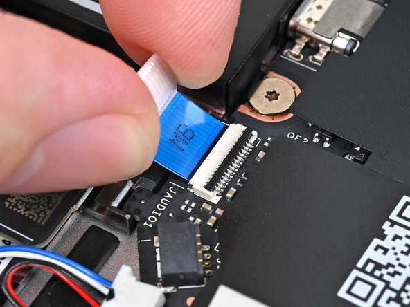 Slide the Audio Board cable straight into its socket.