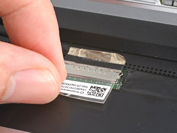 Use your fingers to flip up the plastic tab and access the connector underneath.