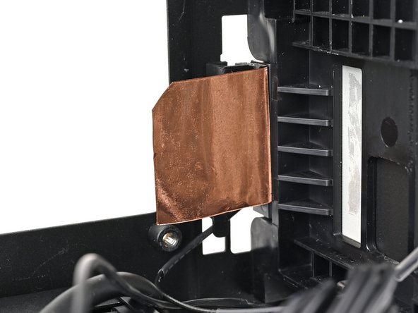 Remove the liner from the back of your replacement right antenna.