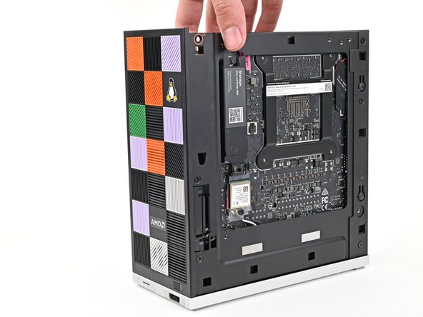 Lay the left side of the Desktop on your work surface so the underside of the Mainboard is facing upward.