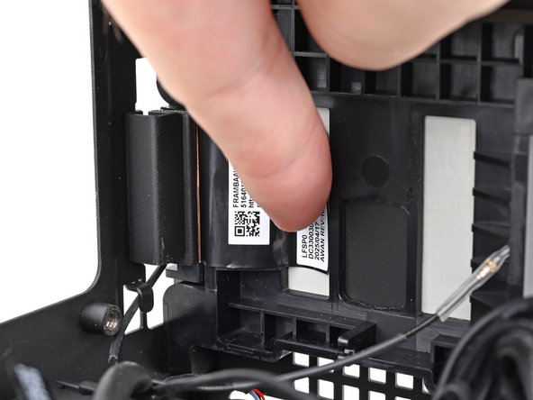 Press the right antenna's copper film onto the chassis and adhere it.