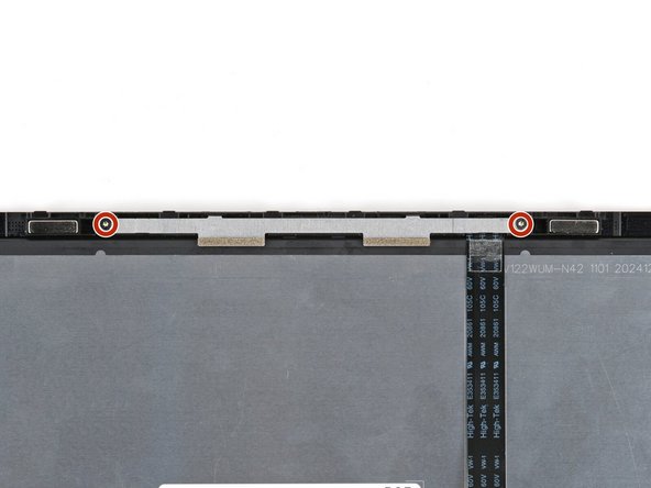 Use your Framework Screwdriver to install the two 3.3 mm‑long T5 Torx screws to secure the webcam bracket.