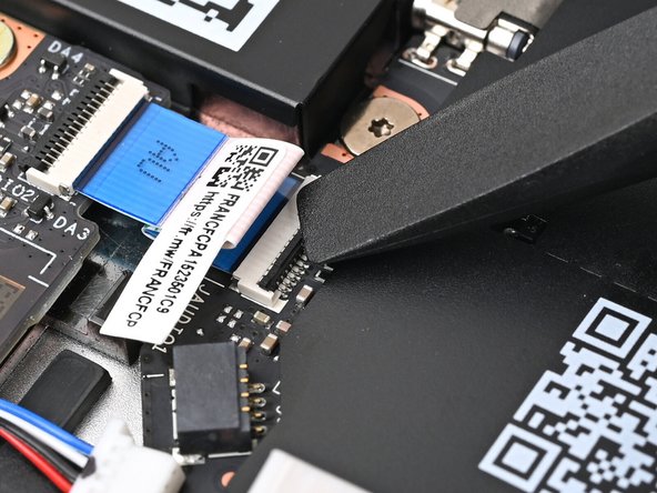 Use the flat end of your Framework Screwdriver, or a clean fingernail, to press down the locking tab on the Audio Board ZIF connector.
