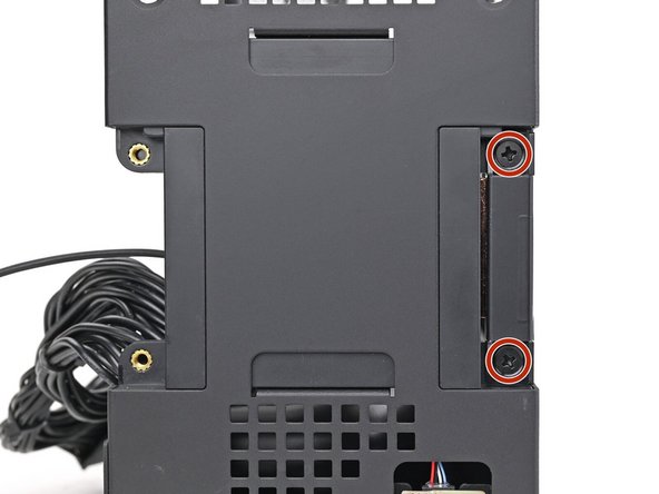 Use your Framework Desktop Screwdriver to install the two 4.0 mm‑long Phillips screws securing the right antenna.