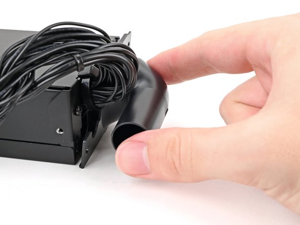 Place the Power Supply Duct on the power supply and align its screw holes.