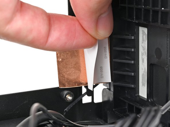 Remove the liner from the back of your replacement right antenna.