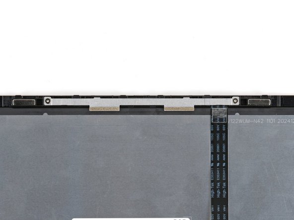 Use your Framework Screwdriver to install the two 3.3 mm‑long T5 Torx screws to secure the webcam bracket.