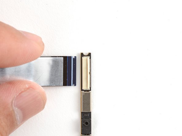 To properly align the replacement webcam cable, you'll install the cable onto the webcam first, install the webcam, then attach the cable onto the display.