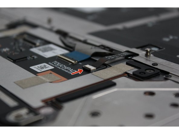 Image one shows a black latch that is flipped up allowing cables to be inserted or removed.