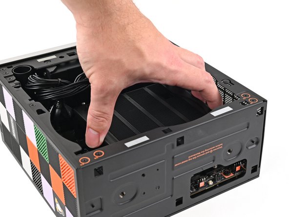 When handling the Heatsink, grab from the left and right sides (sides facing Front Panel &amp; Back IO) as to prevent bent fins and possible damage to the Heatsink.