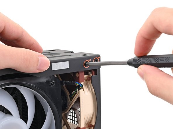 While holding the Desktop steady, use your Framework Desktop Screwdriver to install the eight 4.0 mm‑long Phillips screws securing the top plate.