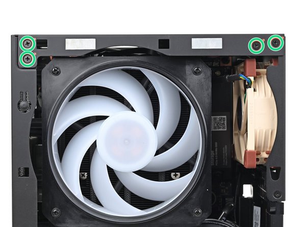 While holding the Desktop steady, use your Framework Desktop Screwdriver to install the eight 4.0 mm‑long Phillips screws securing the top plate.