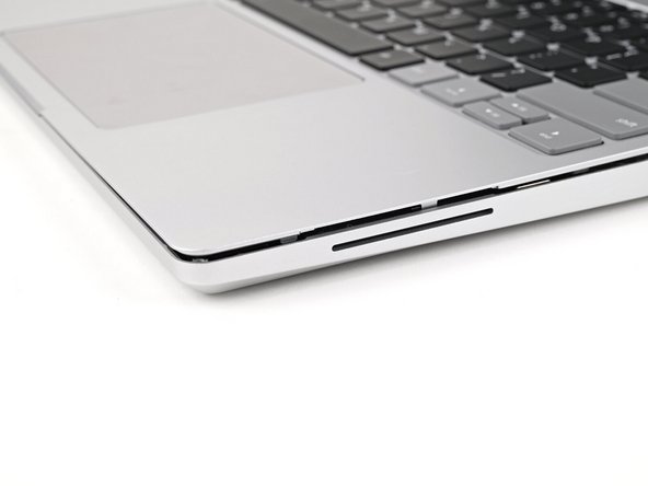 The bottom right corner of the Input Cover won't sit flush with the laptop until you tighten its screws.