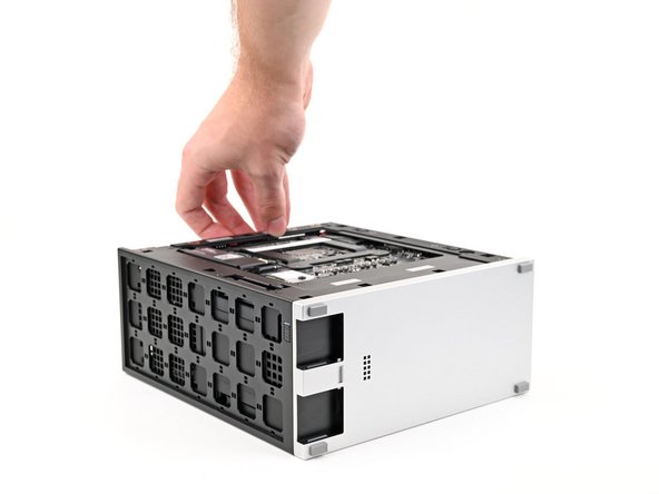 Lay the left side of the Desktop on your work surface so the Mainboard is facing upward.