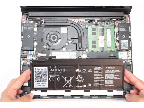 Use your fingernail to gently Lift the battery up and away from the bottom cover. Carefully lift it out and keep it in a safe place.