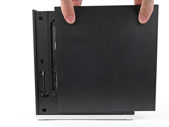 Slide the Right Panel onto the right edge of the chassis, from top to bottom, and press it flat to ensure its clips are slotted into place.