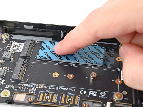 Use your finger to gently press the thermal pad onto the adapter.