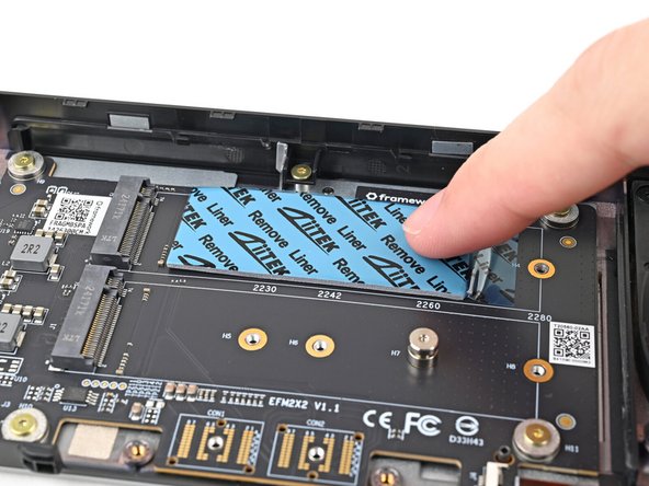 Use your finger to gently press the thermal pad onto the adapter.