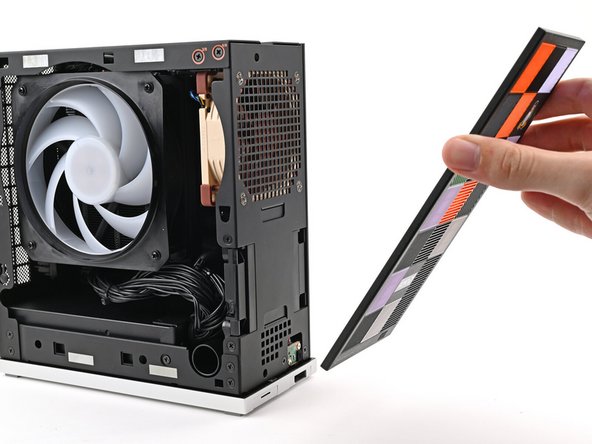 Lay the bottom of the Front Panel on the small, protruding lip in the silver base to align its tabs.