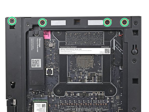 While holding the Desktop steady, use your Framework Desktop Screwdriver to install the eight 4.0 mm‑long Phillips screws securing the top plate.