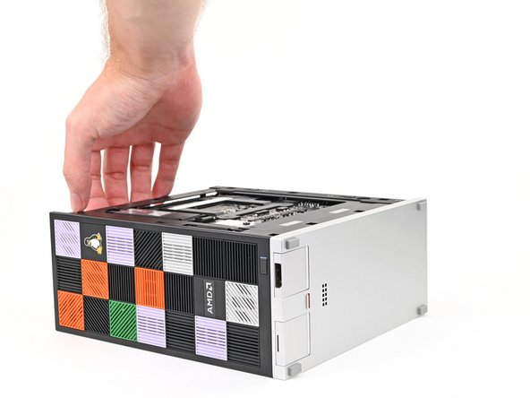 Lay the left side of the Desktop on your work surface so the underside of the Mainboard is facing upward.