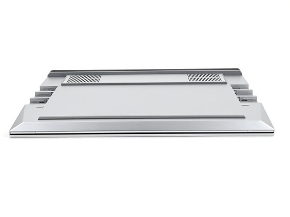 Close the laptop and flip it over.