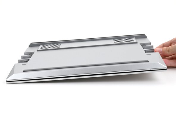 Close the laptop and flip it over.