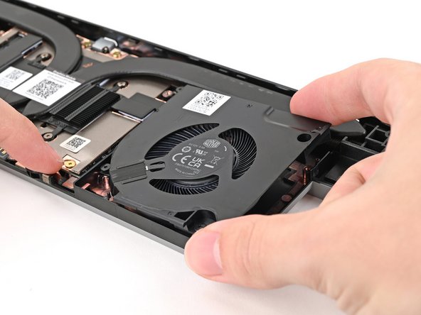 Use one hand to press the fan cable flat to the module.