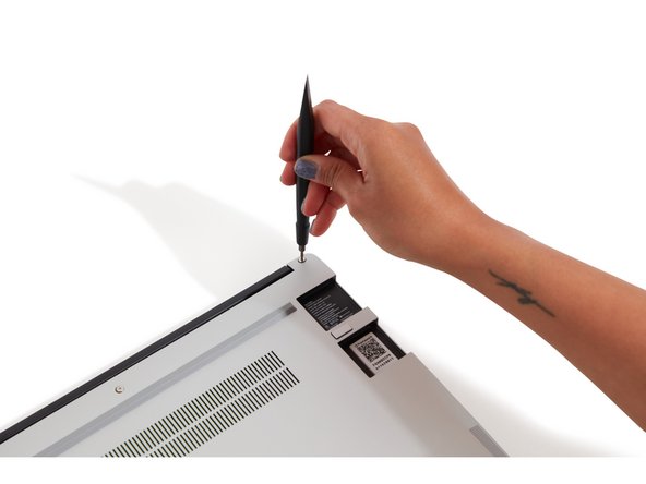 Using the T5 bit in the Framework Screwdriver, unscrew the 5 fasteners on the Bottom Cover. These fasteners will remain attached in the Bottom Cover so that you do not lose them.