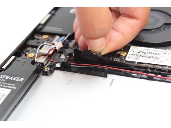 Do not completely remove the tape from the Bottom Cover, peel it back just enough to reveal the wires.