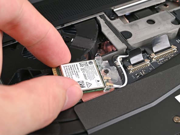 Rotate the Wi-Fi module towards the top of the laptop to keep it out of the way of the Mainboard.