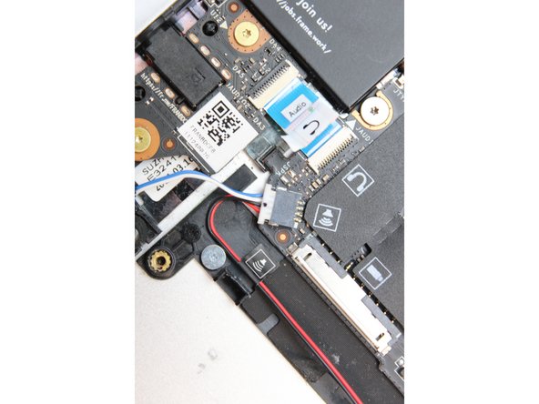 Using your fingers and a slight amount of force, insert the speaker connector straight into the Mainboard.