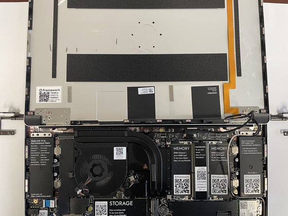 Take the new Top Cover and place it under the Hinges.