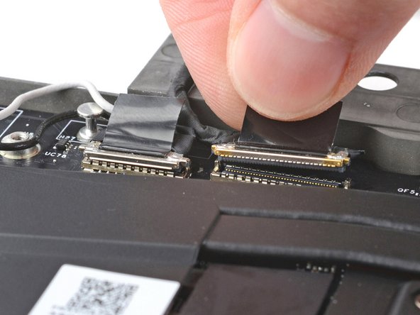 Repeat for the display cable connector next to it.