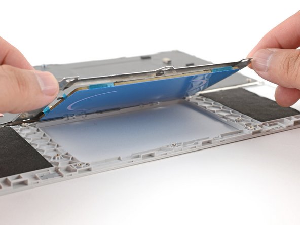 Lay the touchpad into its Input Cover recess.