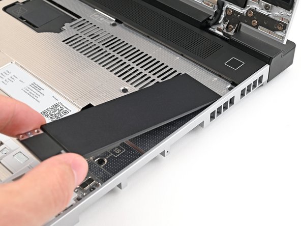 Hold the Input Module at a slight downward angle and align it with one of the dotted lines on the Mid Plate.