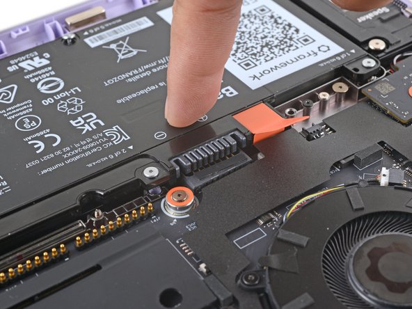 Use your finger to push the battery down near its connector to reconnect it.