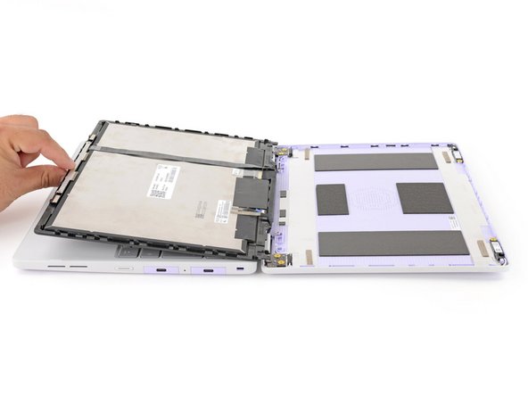 Use your fingers to carefully swing the display over so it lies on top of the keyboard.