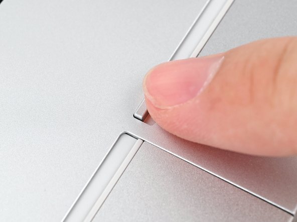 Use your finger to flip both latches and lock the rows of Expansion Cards.