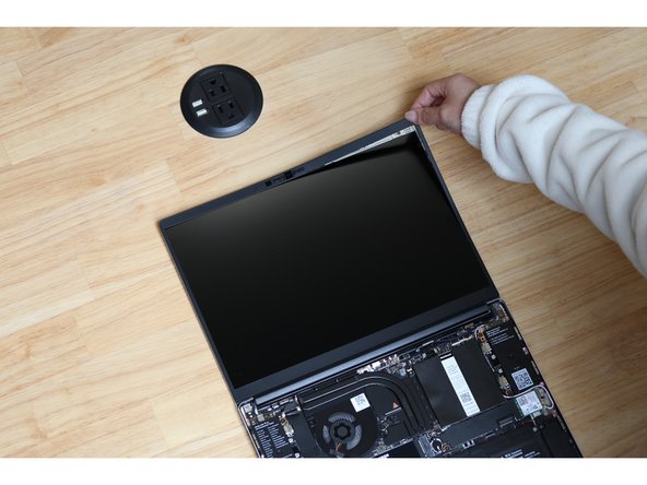 Open the Framework Laptop 180 degrees to attach the Bezel.