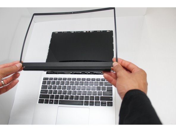 The Framework Bezel is attached by magnets so you will not require any tools to remove it. Just use your fingernail and pry the Bezel away from the display from one of the top corners of the Framework Laptop.