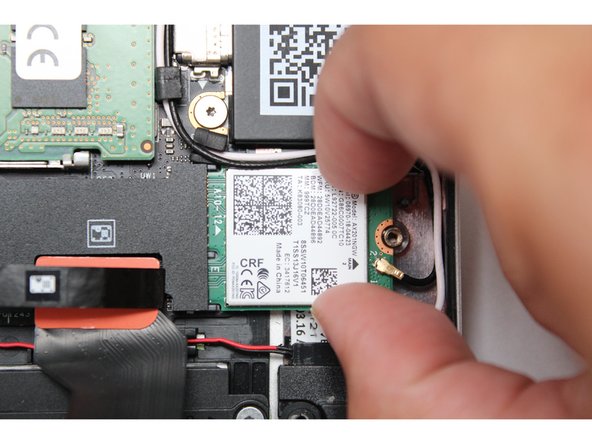 Using your fingers gently slide the WiFi module out of the socket.
